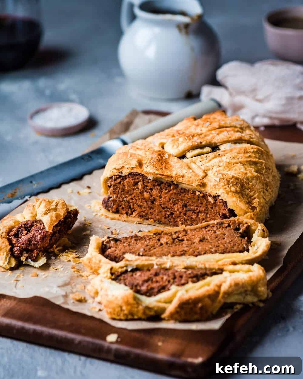 Vegan Holiday Survival Guide: Thrive at Festive Meals 3 sliced vegan wellington on a cutting board.