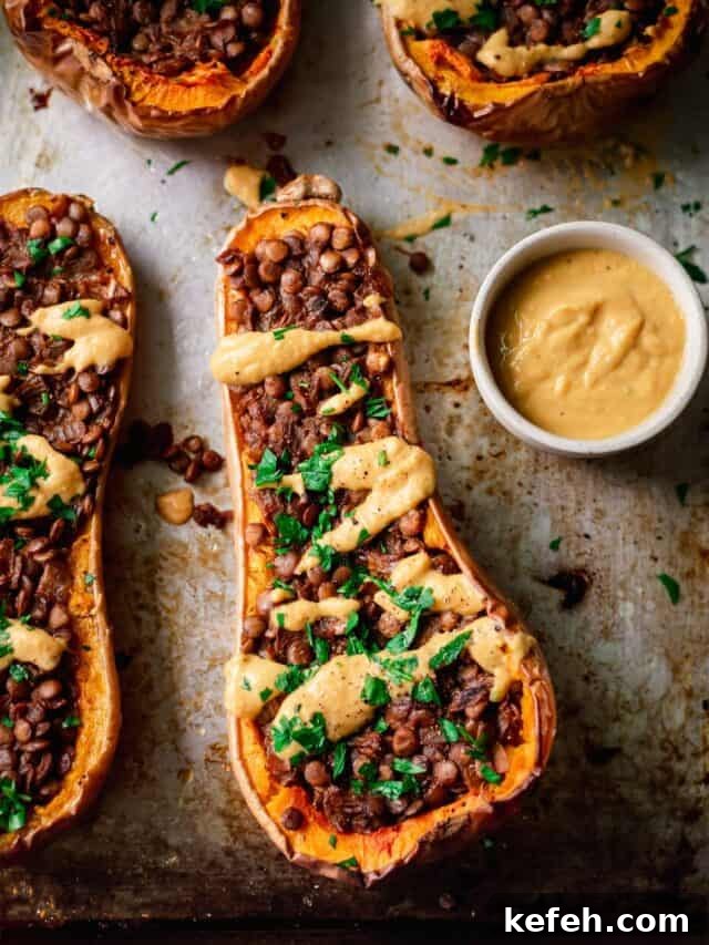 Vegan Holiday Survival Guide: Thrive at Festive Meals 8 creamy lentil stuffed butternut squash on a sheet pan.
