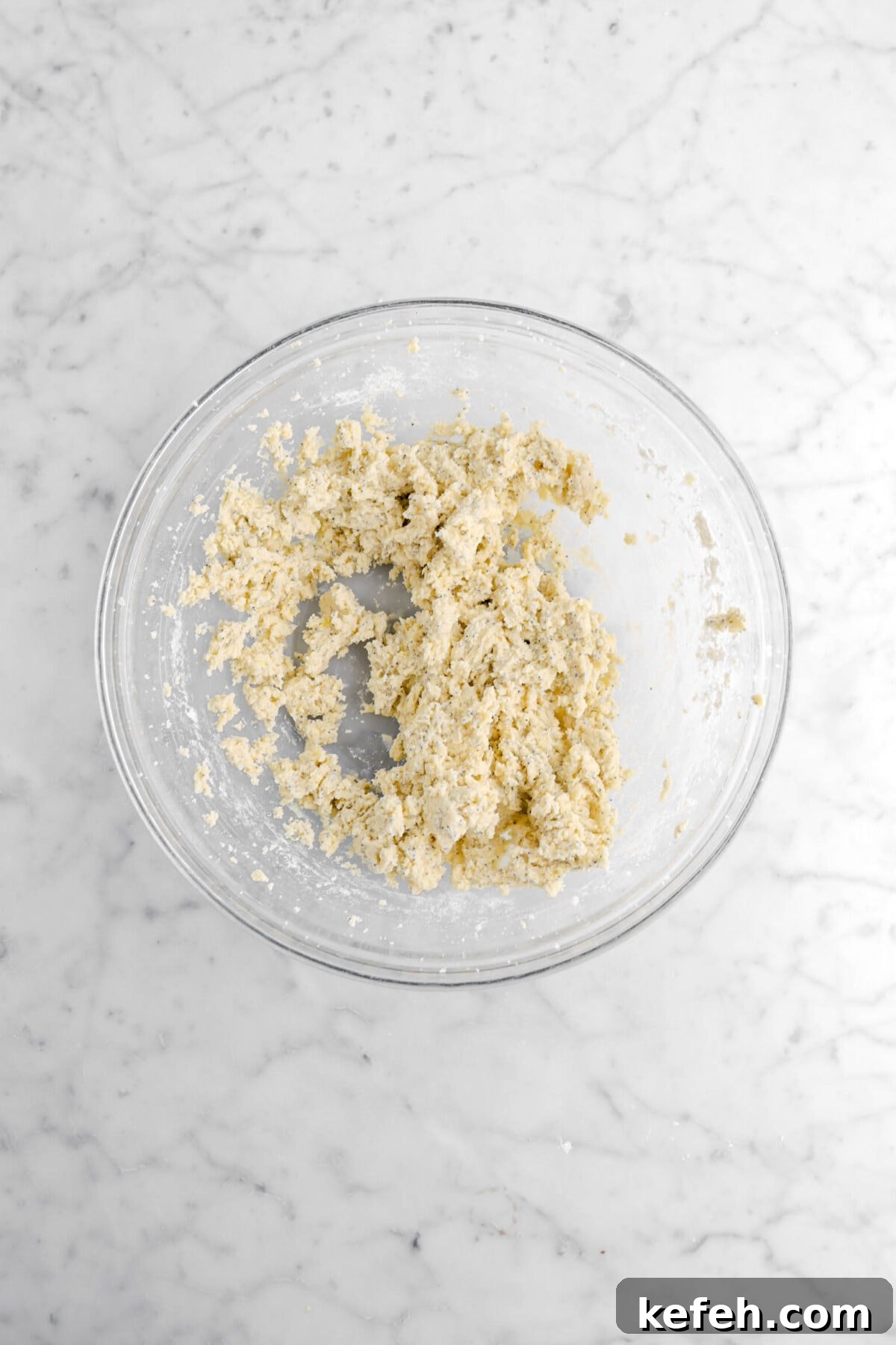 Lemon Poppy Seed Cookies with Lemon Drizzle Recipe 8 cookie dough in glass bowl.