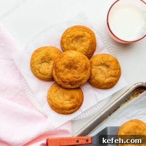 Classic Cinnamon Sugar Snickerdoodle Cookies 7 A plate of freshly-baked homemade snickerdoodles transferred from the cookie sheet with a spatula.