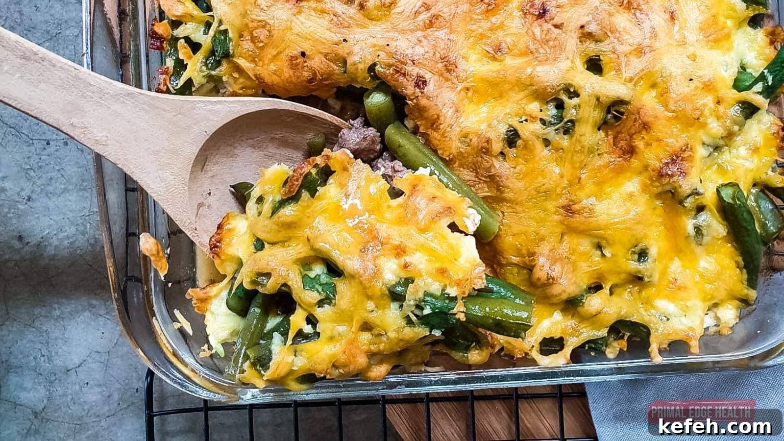 25 Low-Carb Dinners Even Carb Lovers Can't Resist 19 Green bean casserole being served with wooden spoon.