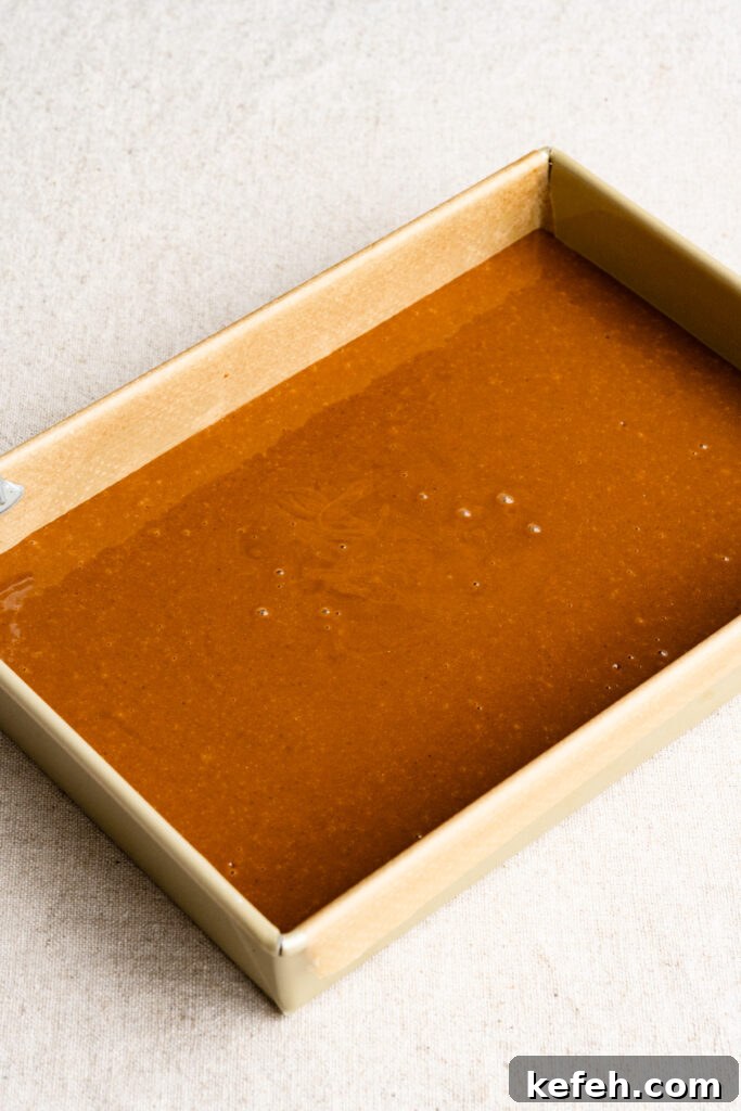 Classic Moist Gingerbread Cake Recipe 9 Rectangular baking pan filled with gingerbread cake batter.